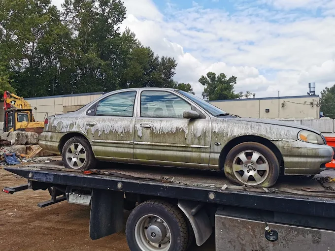 Damaged car being towed for cash in Mission BC